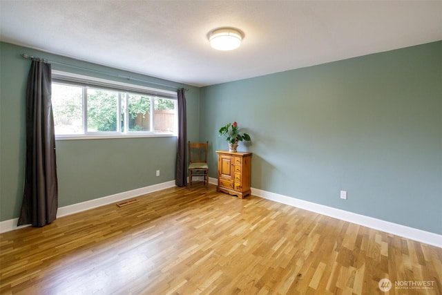 3024 Carpenter Loop SE, Olympia, WA 98503 - spare room with light wood-style floors and baseboards