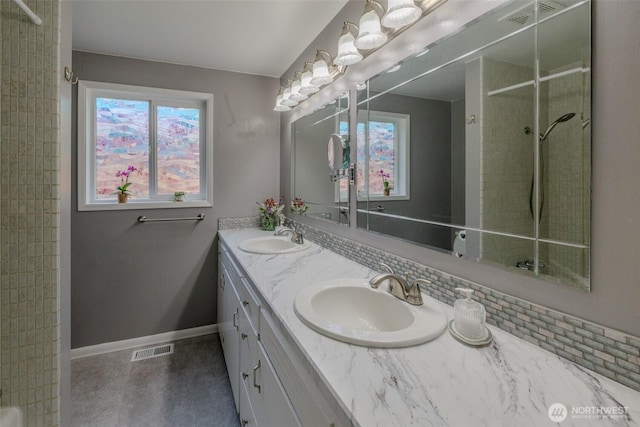 3024 Carpenter Loop SE, Olympia, WA 98503 - bathroom with double vanity, tiled shower, and plenty of natural light
