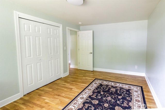 3024 Carpenter Loop SE, Olympia, WA 98503 - unfurnished bedroom with wood finished floors and a closet