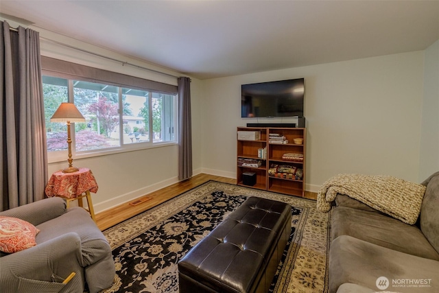 3024 Carpenter Loop SE, Olympia, WA 98503 - living area featuring wood finished floors and baseboards