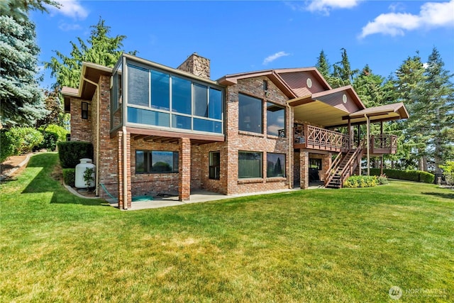3822 School St, Wenatchee, WA 98801 - back of house with a sunroom, a chimney, a patio area, stairway, and brick siding