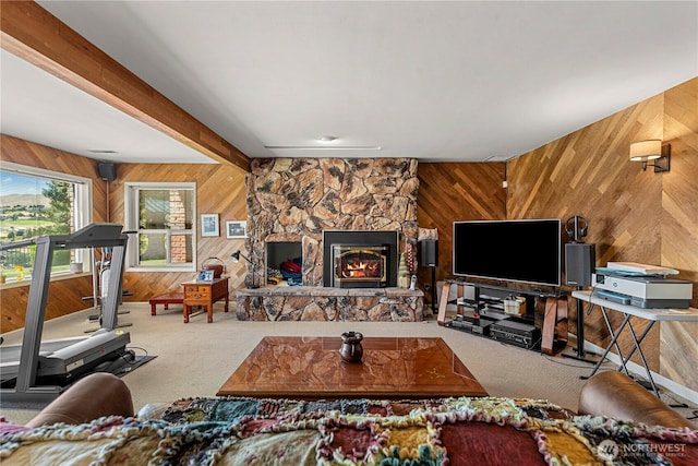 3822 School St, Wenatchee, WA 98801 - carpeted living area featuring wood walls, a fireplace, and beam ceiling