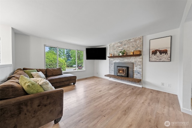 13402 60th Dr SE, Everett, WA 98208 - living room featuring light wood-type flooring and a fireplace