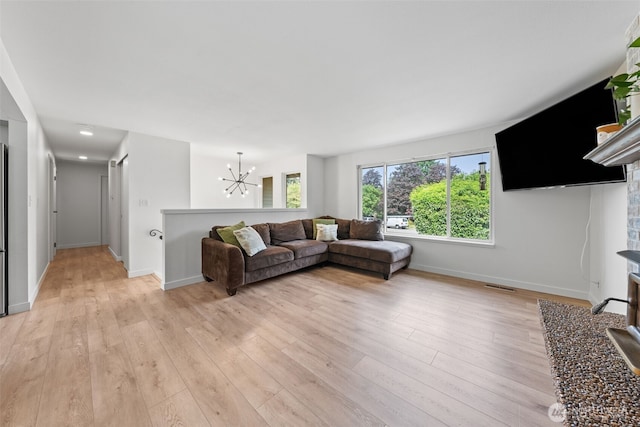 13402 60th Dr SE, Everett, WA 98208 - living room with a chandelier and light wood-style floors
