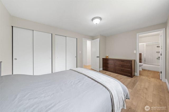 13402 60th Dr SE, Everett, WA 98208 - bedroom with two closets, light wood-style flooring, and connected bathroom
