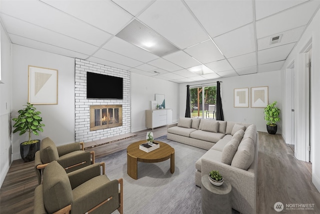 13402 60th Dr SE, Everett, WA 98208 - living room featuring wood finished floors, a fireplace, and a drop ceiling