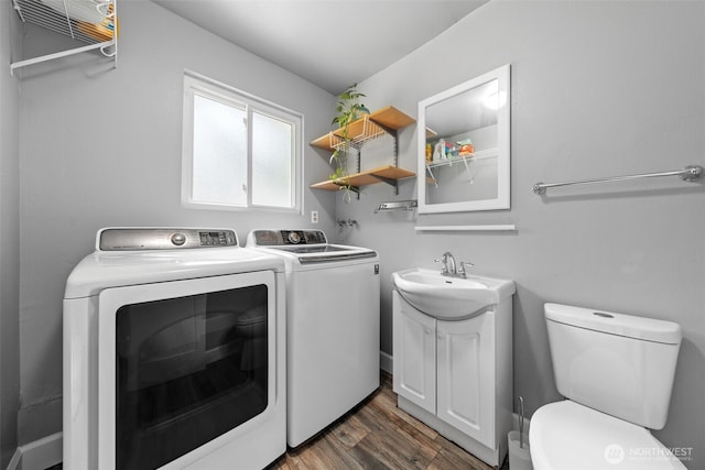 13402 60th Dr SE, Everett, WA 98208 - laundry room with washing machine and clothes dryer and dark wood-style floors