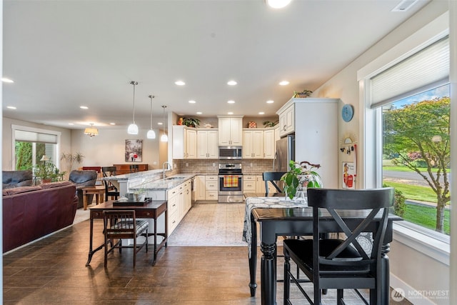 2322 Rice Rd, Chehalis, WA 98532 - kitchen with stainless steel appliances, plenty of natural light, open floor plan, tasteful backsplash, and recessed lighting