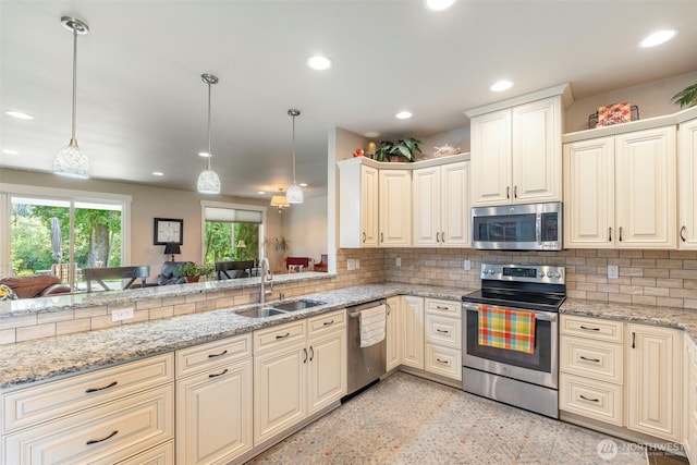 2322 Rice Rd, Chehalis, WA 98532 - kitchen with stainless steel appliances, backsplash, recessed lighting, light stone counters, and hanging light fixtures