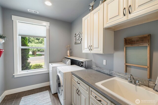 2322 Rice Rd, Chehalis, WA 98532 - laundry room featuring cabinet space, washing machine and clothes dryer, wood tiled floors, and recessed lighting