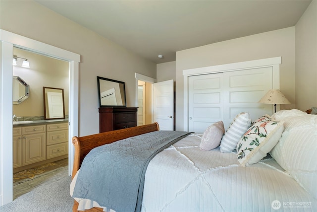 2322 Rice Rd, Chehalis, WA 98532 - bedroom featuring a closet, ensuite bathroom, and light wood-style flooring