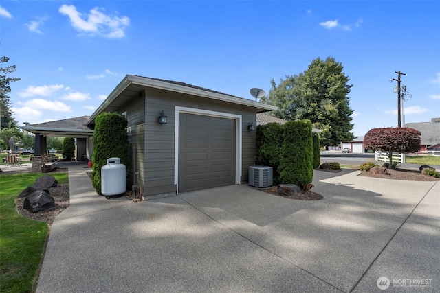2322 Rice Rd, Chehalis, WA 98532 - view of property exterior with concrete driveway, a garage, and an outdoor structure