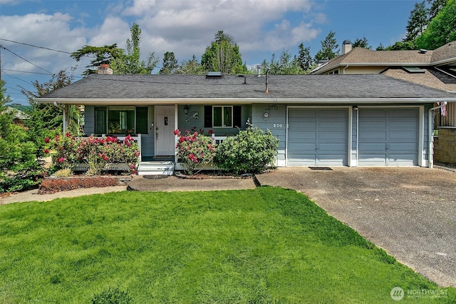 800 S 280th St, Des Moines, WA 98198 - view of front of house with an attached garage, concrete driveway, a front yard, a chimney, and covered porch