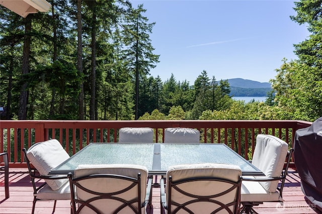 227 Bromley Dr, Orcas Island, WA 98245 - deck featuring a mountain view and outdoor dining area