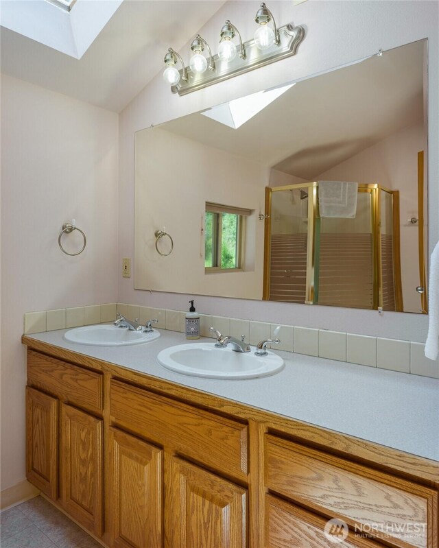227 Bromley Dr, Orcas Island, WA 98245 - bathroom featuring a skylight, a shower stall, double vanity, lofted ceiling, and tile patterned flooring