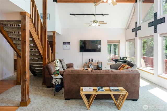 227 Bromley Dr, Orcas Island, WA 98245 - living room with track lighting, a ceiling fan, carpet flooring, stairs, and high vaulted ceiling