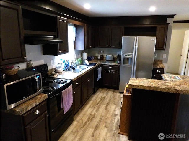 24919 Hoehn Rd Unit 65, Sedro Woolley, WA 98284 - kitchen featuring fridge with ice dispenser, stainless steel microwave, extractor fan, black range with electric stovetop, and light wood-style floors