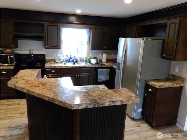 24919 Hoehn Rd Unit 65, Sedro Woolley, WA 98284 - kitchen with stainless steel appliances, open shelves, range hood, dark brown cabinetry, and light wood-type flooring