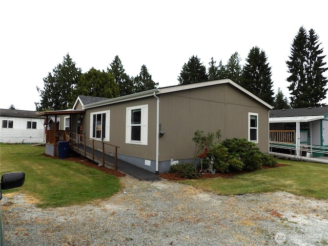 24919 Hoehn Rd Unit 65, Sedro Woolley, WA 98284 - view of side of property featuring crawl space and a lawn