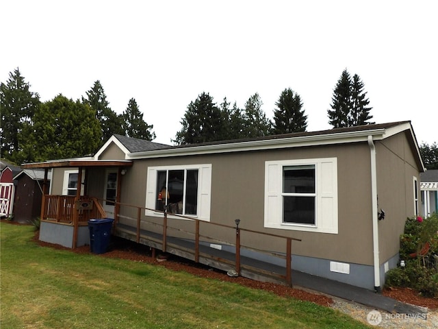 24919 Hoehn Rd Unit 65, Sedro Woolley, WA 98284 - rear view of house featuring crawl space, a yard, and a porch