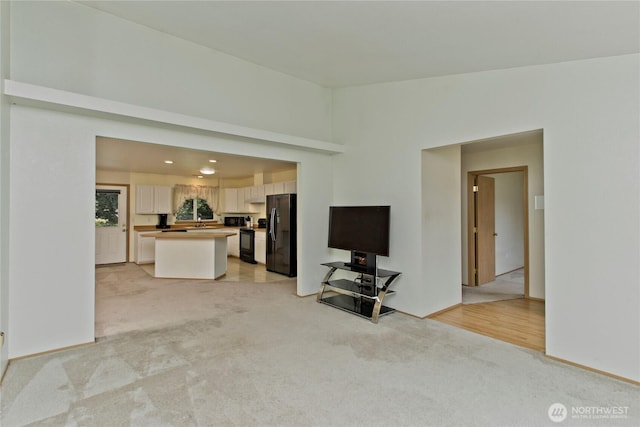 9927 140th St Ct E, Puyallup, WA 98373 - unfurnished living room with light colored carpet