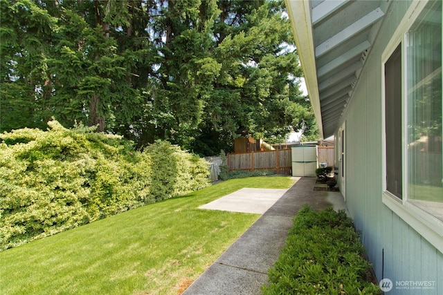 9927 140th St Ct E, Puyallup, WA 98373 - fenced backyard with a storage shed and a patio area