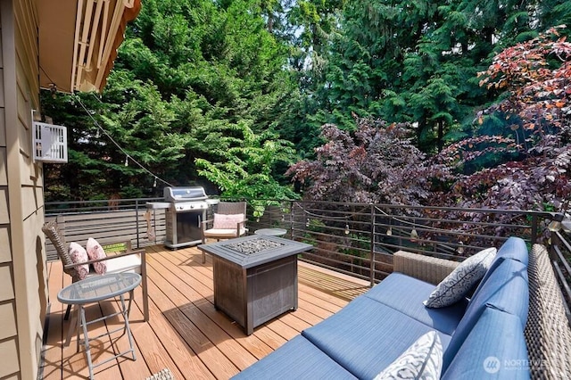 8015 NE 116th Pl, Kirkland, WA 98034 - wooden deck with area for grilling and a fire pit