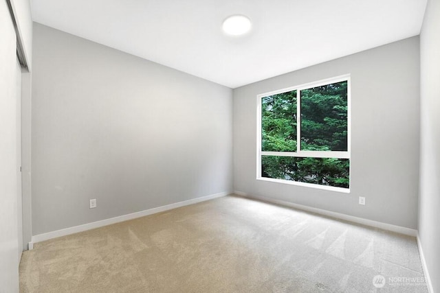 8015 NE 116th Pl, Kirkland, WA 98034 - spare room featuring carpet flooring and baseboards