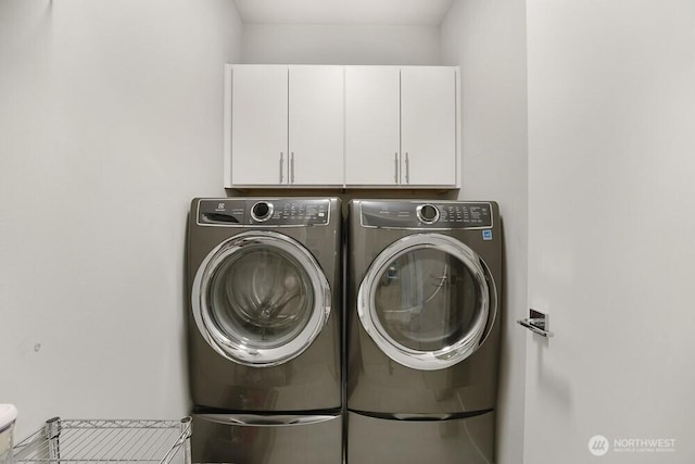 8015 NE 116th Pl, Kirkland, WA 98034 - washroom with washing machine and clothes dryer and cabinet space