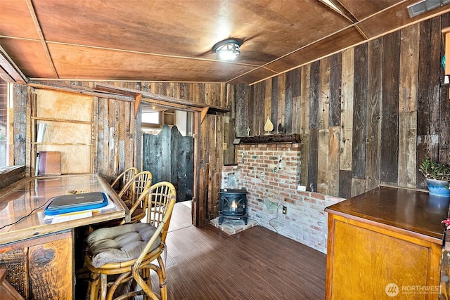 1023 S 60th St, Tacoma, WA 98408 - office area featuring wooden walls, a wood stove, wood finished floors, and brick wall