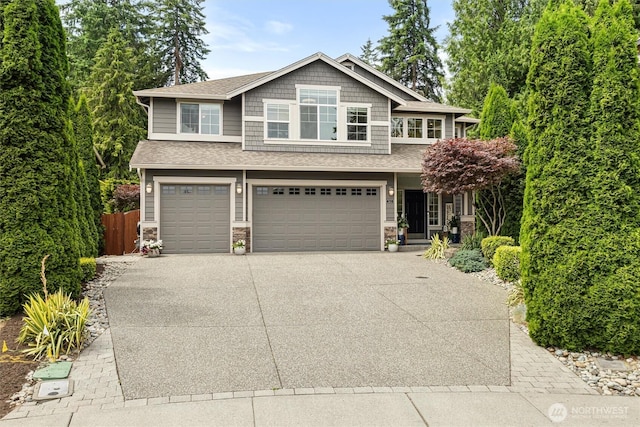 416 199th Pl SE, Bothell, WA 98012 - craftsman inspired home with a garage, driveway, stone siding, and roof with shingles