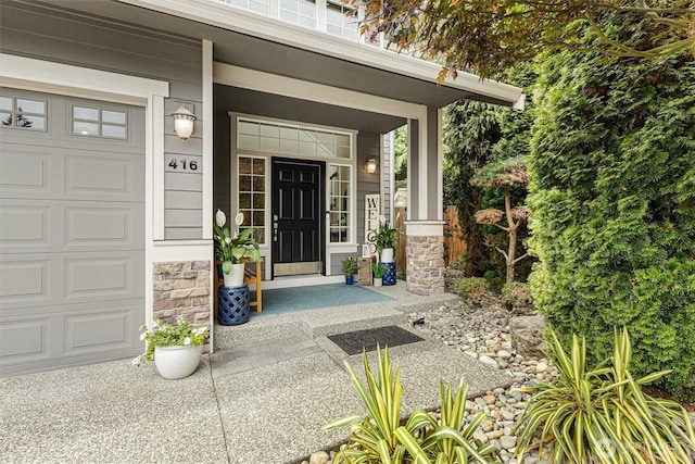 416 199th Pl SE, Bothell, WA 98012 - view of exterior entry featuring a porch, stone siding, and an attached garage