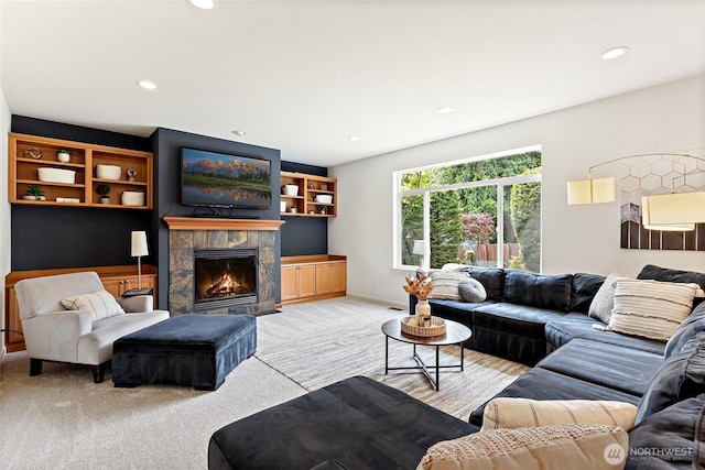 416 199th Pl SE, Bothell, WA 98012 - living area featuring light colored carpet, a stone fireplace, and recessed lighting