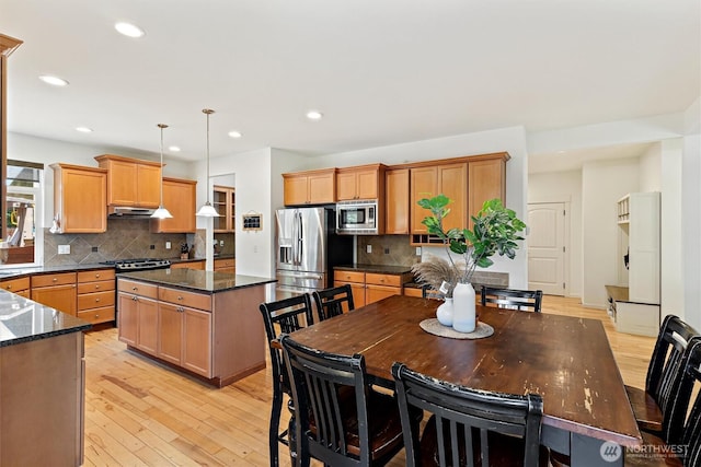 416 199th Pl SE, Bothell, WA 98012 - kitchen featuring stainless steel appliances, under cabinet range hood, a kitchen island, recessed lighting, and light wood-style flooring