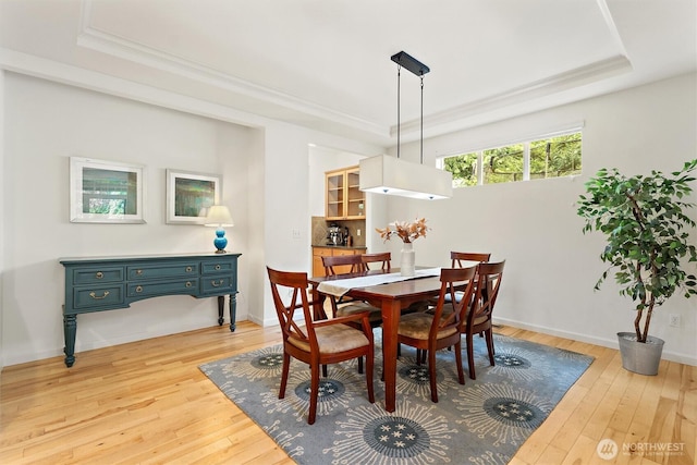 416 199th Pl SE, Bothell, WA 98012 - dining space with a raised ceiling, light wood finished floors, and crown molding
