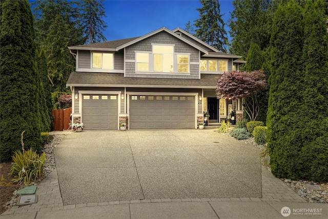 416 199th Pl SE, Bothell, WA 98012 - craftsman house featuring an attached garage, driveway, stone siding, and a shingled roof