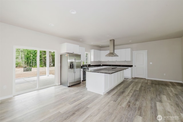 300 E Wild Grape Way, Grapeview, WA 98546 - kitchen with appliances with stainless steel finishes, range hood, white cabinets, and a center island