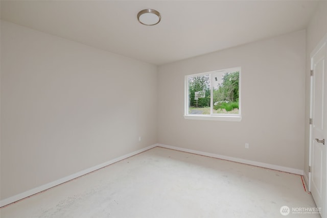 300 E Wild Grape Way, Grapeview, WA 98546 - spare room featuring unfinished concrete flooring and baseboards