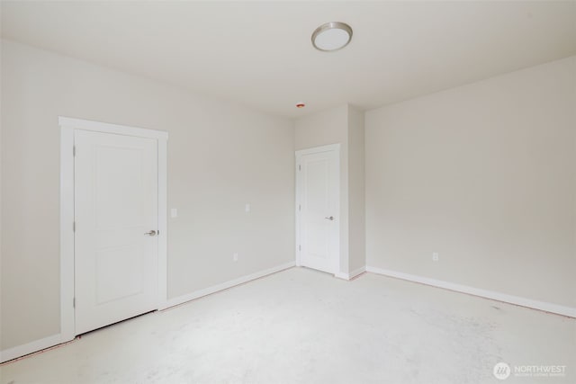 300 E Wild Grape Way, Grapeview, WA 98546 - empty room with concrete floors and baseboards