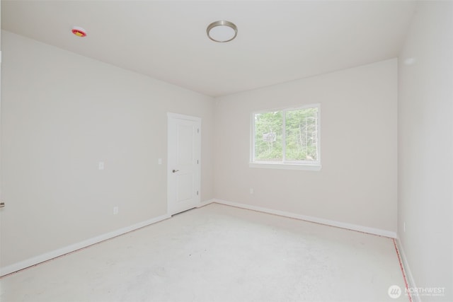 300 E Wild Grape Way, Grapeview, WA 98546 - unfurnished room featuring concrete flooring and baseboards