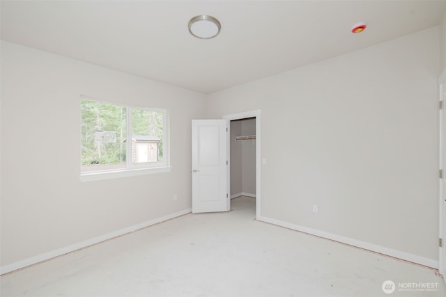 300 E Wild Grape Way, Grapeview, WA 98546 - unfurnished bedroom with a spacious closet and a closet