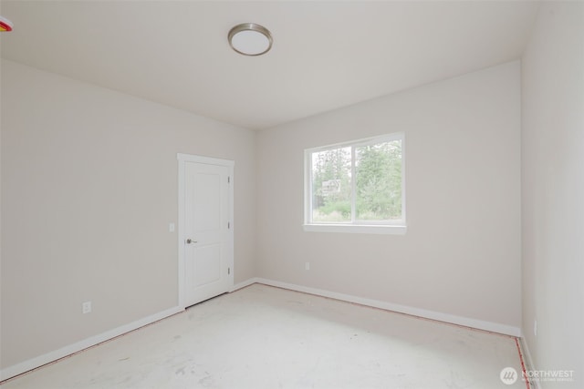 300 E Wild Grape Way, Grapeview, WA 98546 - empty room featuring baseboards and concrete flooring