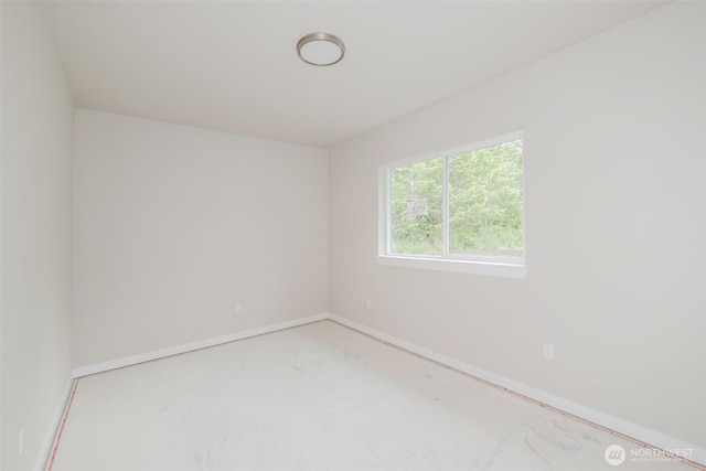 300 E Wild Grape Way, Grapeview, WA 98546 - empty room with baseboards and concrete floors