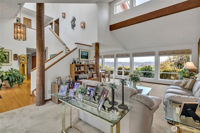 20219 SE 344th St, Auburn, WA 98092 - carpeted living area with high vaulted ceiling, stairway, and a mountain view