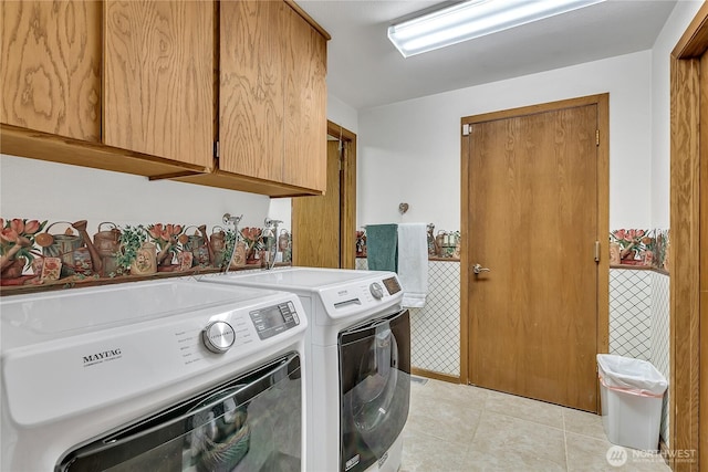 20219 SE 344th St, Auburn, WA 98092 - washroom featuring cabinet space, washing machine and dryer, and light tile patterned floors