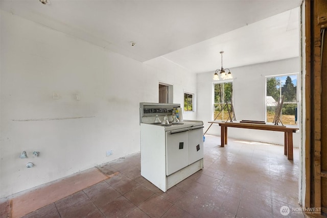 3634 Campbell St NE, Bainbridge Island, WA 98110 - kitchen with white range with electric cooktop, a chandelier, white cabinetry, and decorative light fixtures