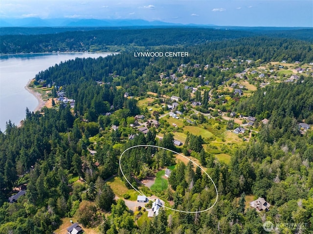 3634 Campbell St NE, Bainbridge Island, WA 98110 - drone / aerial view of a heavily wooded area and a nearby body of water