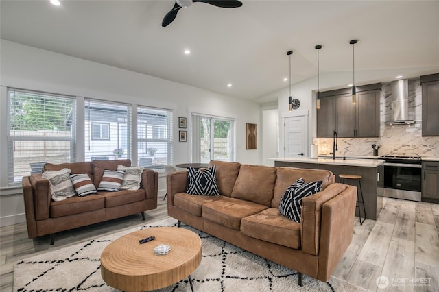 793 Island Cir SE, Ocean Shores, WA 98569 - living room featuring light wood-style flooring, vaulted ceiling, a ceiling fan, and recessed lighting