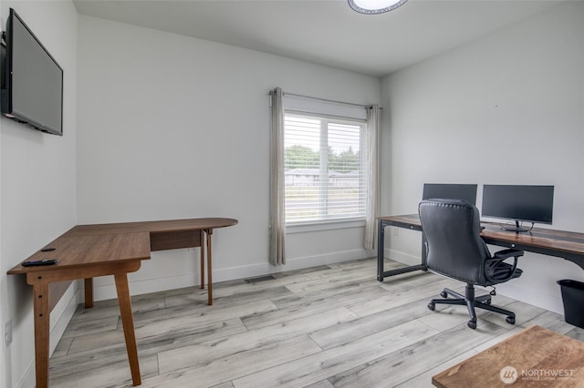 793 Island Cir SE, Ocean Shores, WA 98569 - home office with light wood-style flooring and baseboards