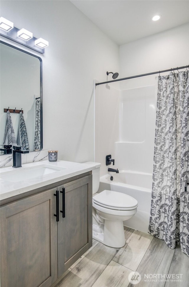 793 Island Cir SE, Ocean Shores, WA 98569 - full bath featuring vanity, shower / bath combo, wood finished floors, and recessed lighting